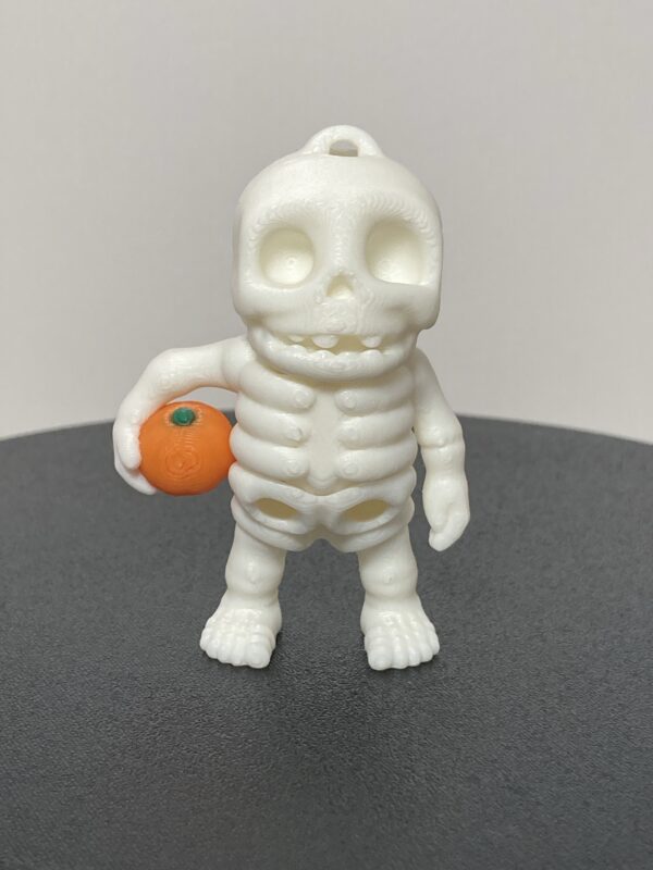 Skeleton Holding Pumpkin Articulating Keychain