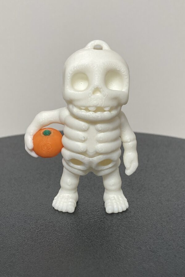 Skeleton Holding Pumpkin Articulating Keychain