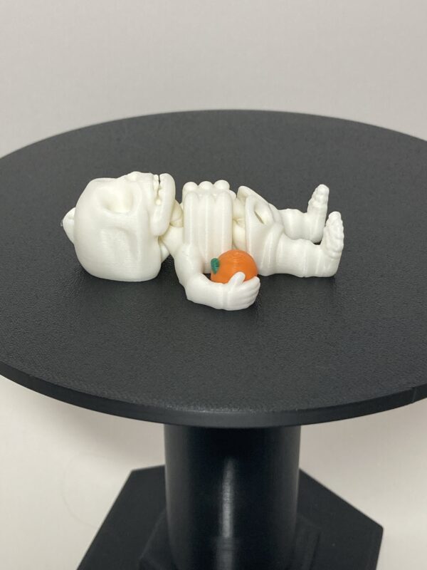 Skeleton Holding Pumpkin Articulating Keychain - Image 2