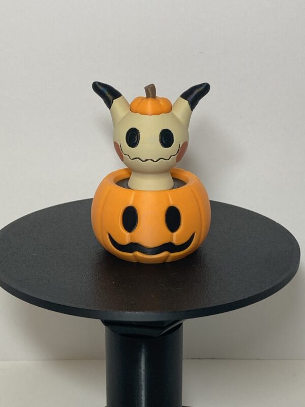 Mimikyu in a Pumpkin Figure